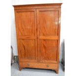 A Georgian mahogany wardrobe, with two panelled doors above two drawers.