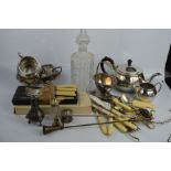 A quantity of silver plate ware to include a tea pot, milk jug and sugar bowl, glass decanter,