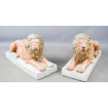 A set of four Grand Tour style recumbent lions.