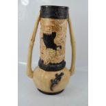 A Bretby art pottery vase, early 20th century, the cylindrical neck decorated in relief with an