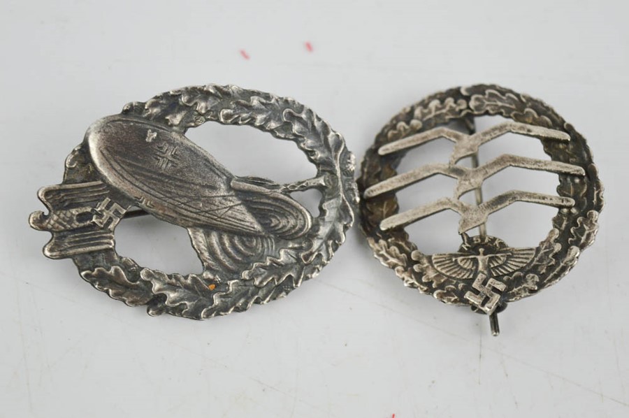 Two WWII German NSKK and Balloon badges, bearing makers marks.