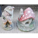 A garden reconstituted stone gnome, and a mushroom house.