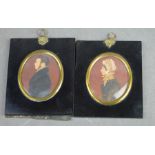 A pair of Victorian oval miniature portraits, watercolour on paper, lady and a gentleman in formal
