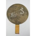 A Vintage Chinese carved bronzed mirror, depicting cranes, turtle and prunus blossom, original