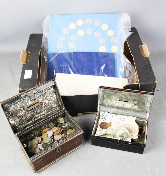 A quantity of coins, mostly GB examples, including vintage money box tins.