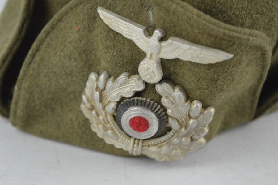 A Rare WWII German Officers Finnish winter cap with badges. - Image 2 of 3