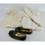 A pair of childrens black leather shoes, a Victorian christening gown and others.