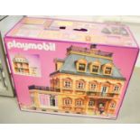 A Playmobile dolls house and accessories, boxed.