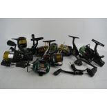 A group of fishing reels, to include fix spool and multiplier reels by Mitchell, Okuma, and others.