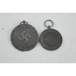 A German Luftshutz medal and an Austrian medal.