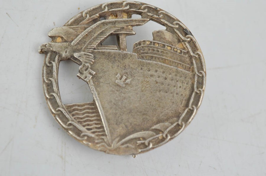 A silver blockade runner badge, bearing makers mark, Berlin.