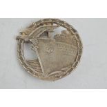 A silver blockade runner badge, bearing makers mark, Berlin.