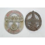 A German Shooting badge, 1939, and a Police Motor Staffel motorcycle badge.