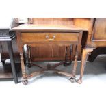 A 20th century oak low boy with single drawer and wavy stretcher, 82 by 53 by 74cm.