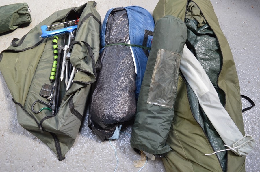 A fishing bivvy / tent, and a large quantity of bag sticks and rod rests.