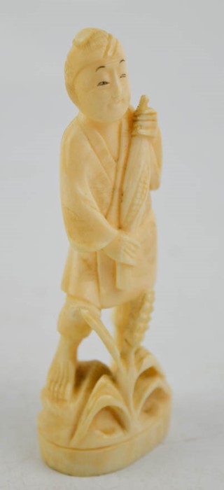 A 19th century Japanese hand carved Okimono statue 'Sweetcorn Picker'.