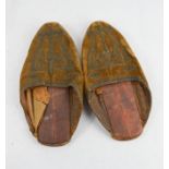 A pair of early leather slippers, with brown velvet fronts embossed with metal thread stitching