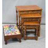 A nest of oak tables and a rectangular needlework stool.