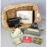A vintage basket containing tins, Studio modelled pepper, glass jar, camera and picture.