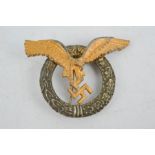 An early Nazi pilots badge with two rivets, bearing makers mark.