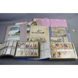 Two small albums of cigarette card collections, together with four scrap books containing