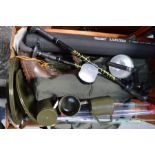 Fishing waders, rod storage tubes, and quiver tips and a group of camping plates and mugs.