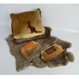 A vintage Kangaroo fur bag, two similar purses and a rabbit skin pelt.