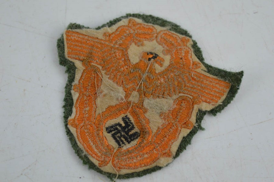 A Budapest 1944/45 Nazi uniform shield, and two military Nazi police badges. - Image 5 of 5