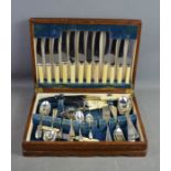 A canteen of Sheffield plate cutlery, with blue velvet lining.