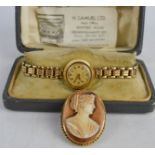 A Hefik wristwatch with rolled gold strap, and 9ct gold cameo brooch.