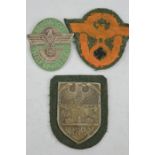 A Budapest 1944/45 Nazi uniform shield, and two military Nazi police badges.