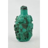 A vintage Chinese carved turquoise coloured figural snuff bottle.