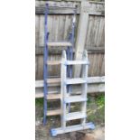 A group of step ladders and a combination ladder.