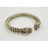 A Tibetan Miau silver twist link, Dragons head bangle, 62g.