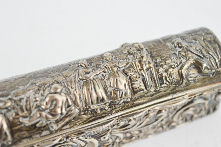 A silver trinket box, embossed with village folk and scrollwork, Birmingham 1909, 2.02toz. - Image 2 of 2