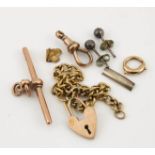 A group of scrap 9ct gold, including a heart clasp and bracelet, fob, links, and a gold filling, 5.
