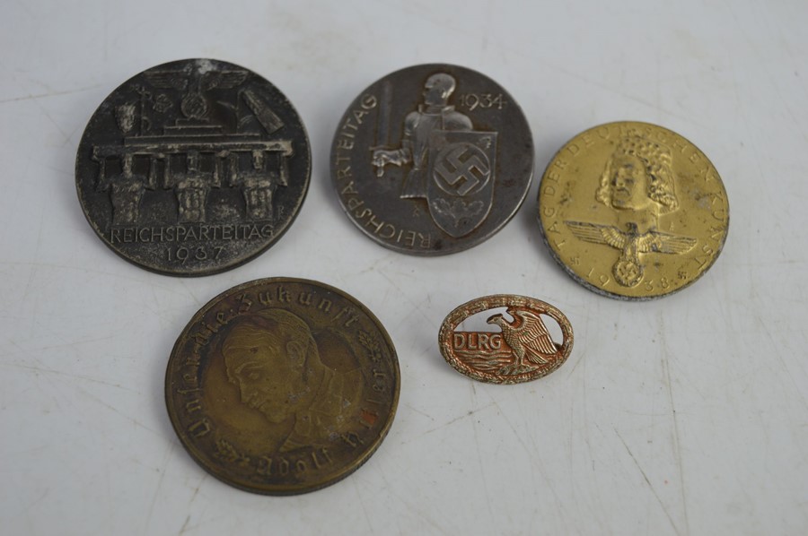 Five Nazi part badges all with makers marks and a 1937 Adolf Hitler commemorative coin