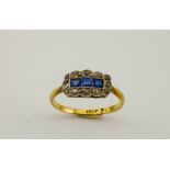 An 18ct gold, diamond and sapphire Edwardian ring, size J/K 2.1g.