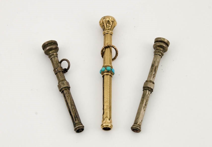 A gold (unmarked) 19th century propelling pencil set with turquoise and red glass top, 5½cm,