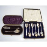 A set of six silver spoons, and a boxed christening set.