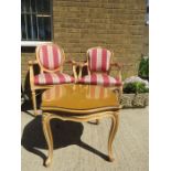 A pair of Louis XIV style chairs with oval backs together with a coffee table