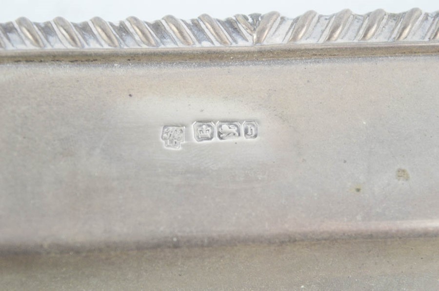 A silver rectangular dish raised on four bun feet, with scallop shells to the corners and decorative - Image 3 of 3