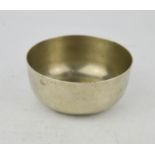 An early 20th century unusual stamped German silver Buddhist singing bowl, with inscription hammered