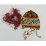 A late 18th / early 19th century beaded pouch, with drawstring rope and tassel.