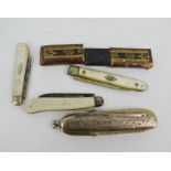 Four silver Victorian fruit knives; two with mother of pearl handles, a mother of pearl example with