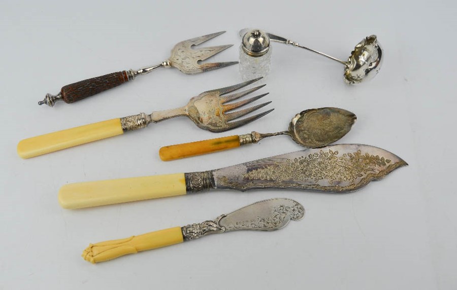 A silver plated fish slice and fork, with silver ferules, a silver and bone handled slice, silver