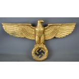 A cast aluminium Nazi eagle emblem, the liberation of Jersey 1945 casting date 1937, 37 by 69cm.