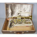 A brass trumpet by F.E Olds & Son of Los Angeles California, serial number 1433 with wooden case.
