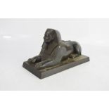 An Egyptian Brass Sphynx with bronze patination