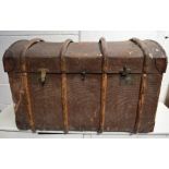A leather wood banded steamer trunk
